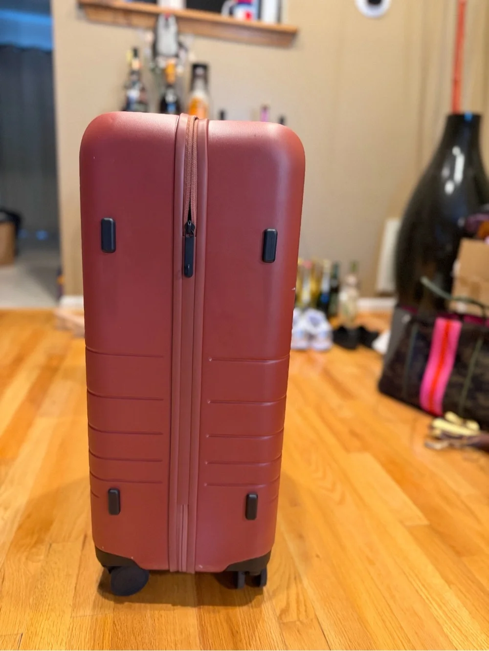Monos medium check in 24” terracotta color suitcase LIKE NEW